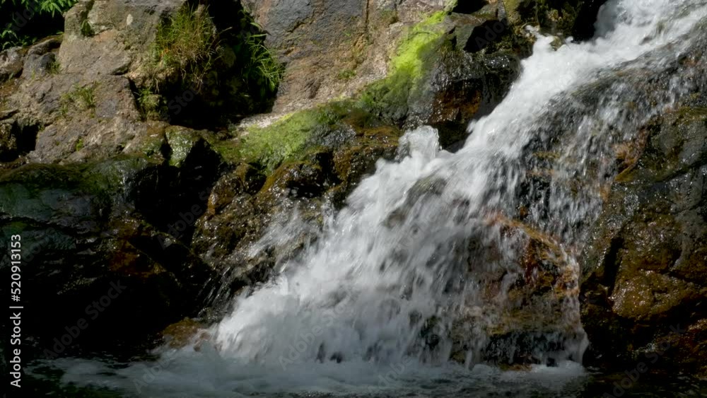 Beautiful stream over Rocks. Waterfall in green rain forest. Beauty in nature Beautiful stream over Rocks. Waterfall in green rain forest. Beauty in nature