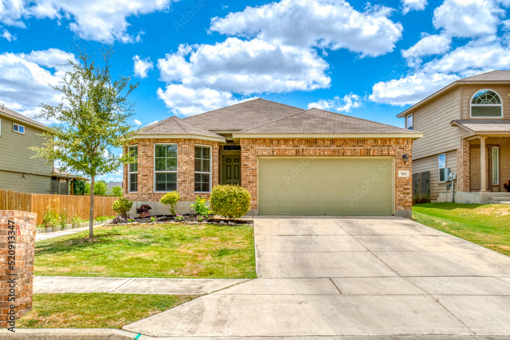 Brick home with a driveway Brick home with a driveway