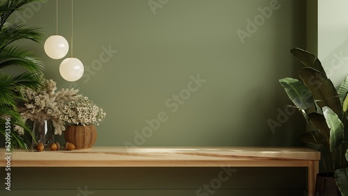 Green wall panelling with wooden shelf in kitchen room.