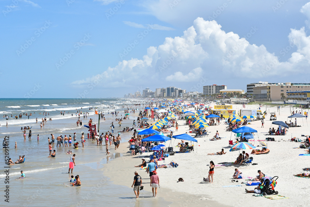 Tourists and locals packing Daytona Beach on a hot summer day on the east coast of central Florida Tourists and locals packing Daytona Beach on a hot summer day on the east coast of central Florida