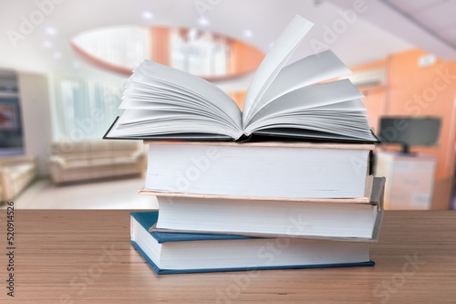 A simple composition of many books, stack or pile of books on wooden table concept