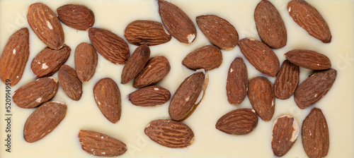 bar of white milk natural chocolate with roasted whole almonds