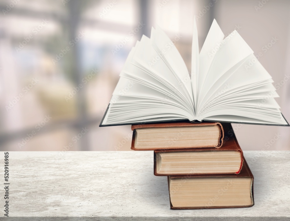 A simple composition of many books, stack or pile of books on wooden table concept A simple composition of many books, stack or pile of books on wooden table concept