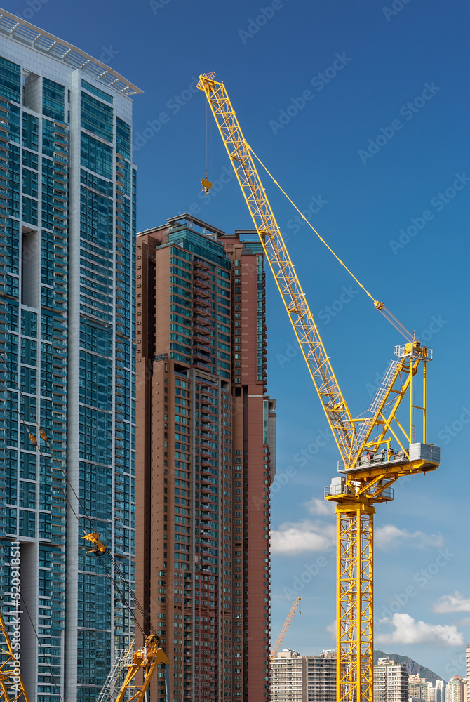 High rise residential building and crane in construction site in Hong Kong city