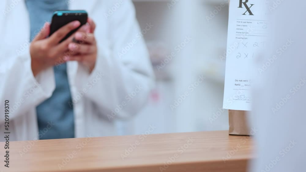 Touching debit or credit bank card to a machine for contactless or online payment at a till point or checkout counter. Closeup of a person using a wireless method to pay at a terminal of a drugstore