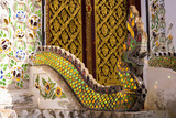 Serpent statue railing Wat Phra That Cho Hae, Phrae Province, Thailand.