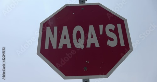 Indigenous peoples of Canada Stop sign in Mi Kmaq - Naqa Si - slow motion photo