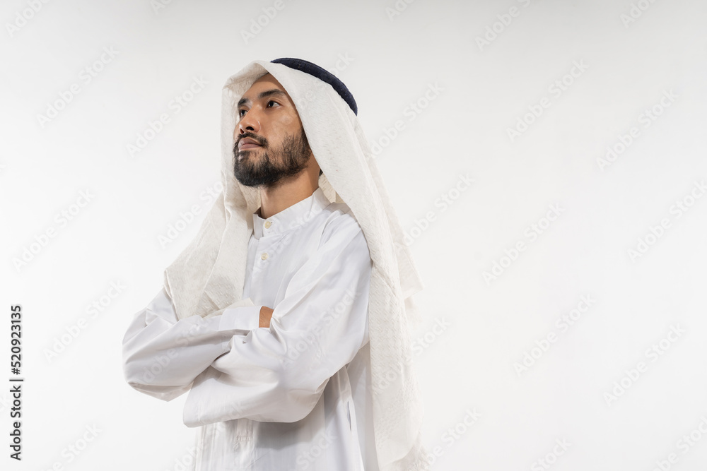 an arabian young man in a turban standing looking up and away thinking an arabian young man in a turban standing looking up and away thinking