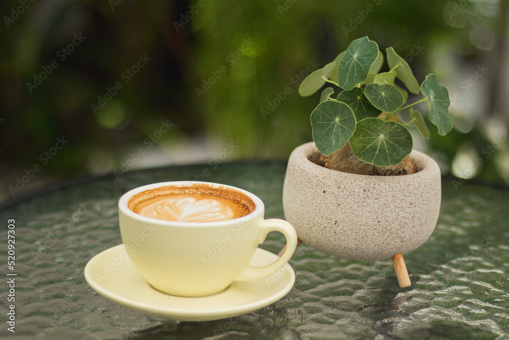 cup of coffee with leaves
