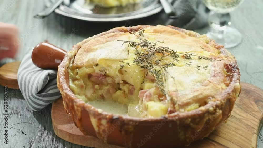 Serving french potato and cheese casserole.
Serving french potato and cheese casserole.