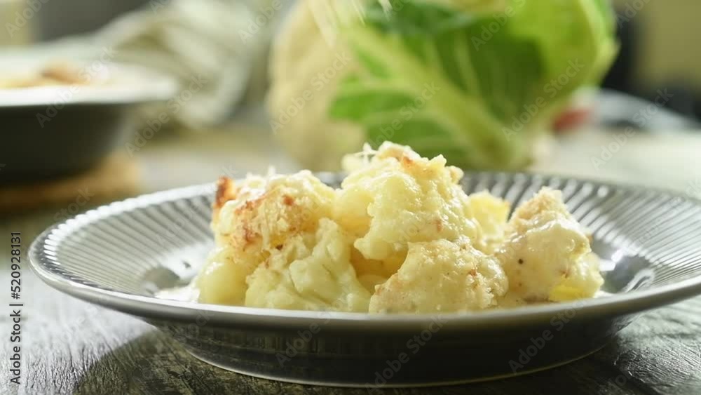 The chef tastes the freshly prepared cauliflower gratin.
The chef tastes the freshly prepared cauliflower gratin.