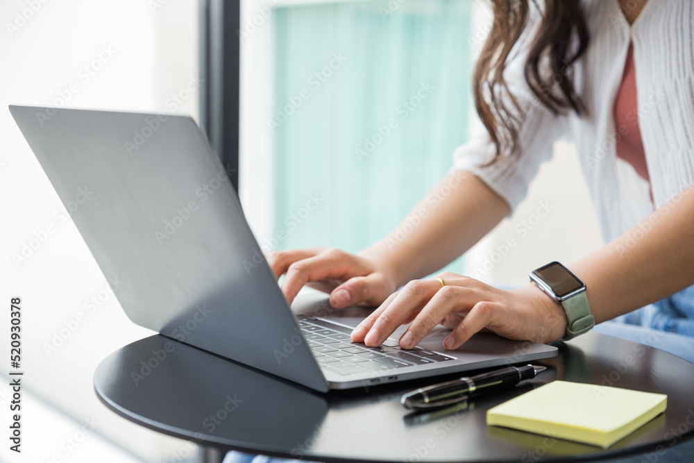 Beautiful business woman working on a laptop computer in home office, Work from home. Beautiful business woman working on a laptop computer in home office, Work from home.