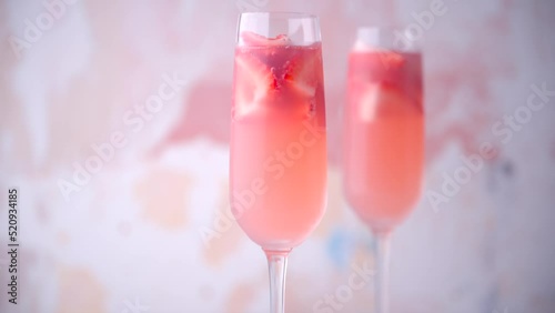 strawberry pink mimosa in champagne glass