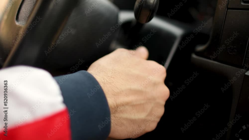 man starts the engine of a van man starts the engine of a van