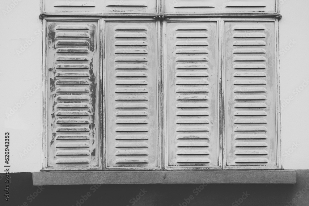 white window with shutters