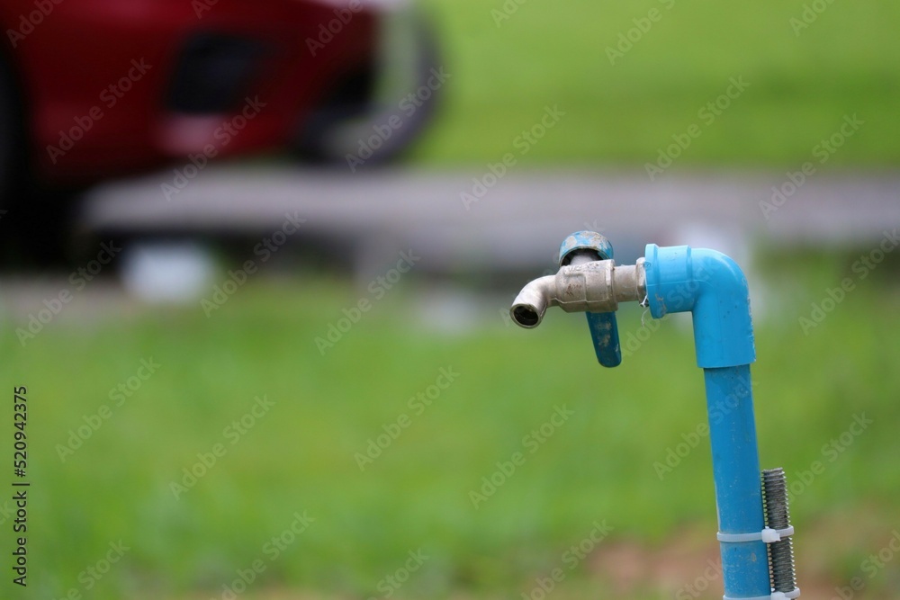 sprinkler spraying water on grass