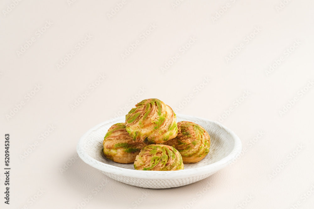 Choux pastry contains butter, water, flour, and eggs. Choux pastries are sometimes filled with cream to make cream puffs. 
