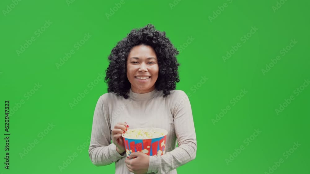 african american cheerful woman laughing eating popcorn watching comedy film concept Isolated on Green Screen african american cheerful woman laughing eating popcorn watching comedy film concept Isolated on Green Screen