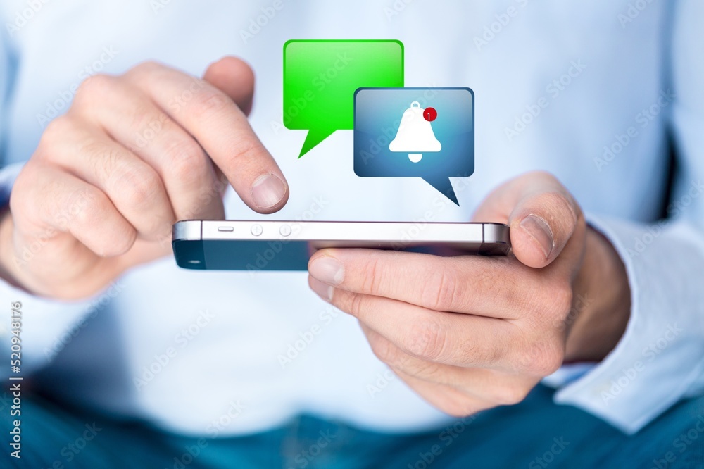 Alert Bell Notification on Smartphone in hand Alert Bell Notification on Smartphone in hand