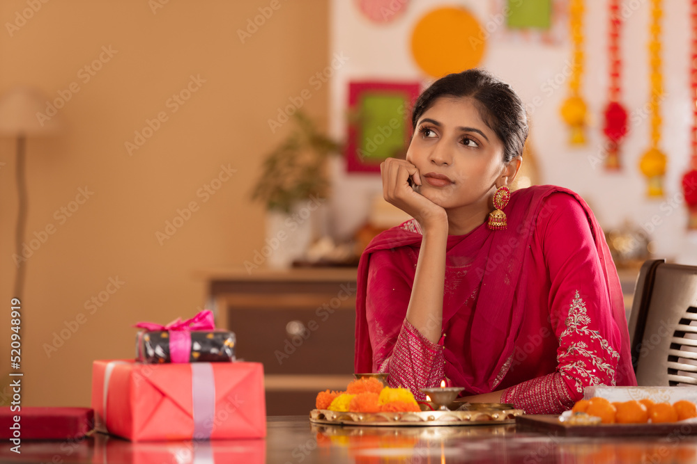 Sister with pooja plate waiting for her brother on the occasion of Raksha Bandhan Sister with pooja plate waiting for her brother on the occasion of Raksha Bandhan