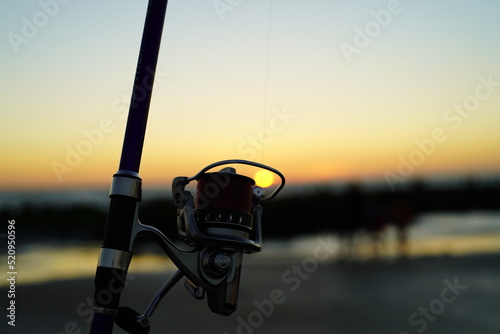 Fototapeta fishing rod at sunset