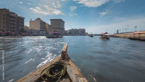 Time lapse taken from boat , abras sail crossing Dubai creek. photo