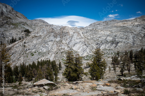A lenticular cloud forms above an alpine range in Sequoia National Park, California
