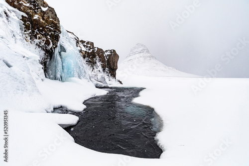 Lake in mountainous terrain in winter