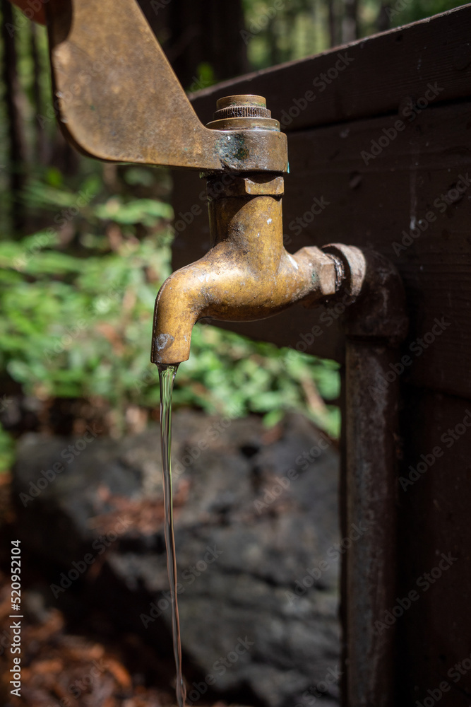 water drips from a campground spigot on a faucet water drips from a campground spigot on a faucet