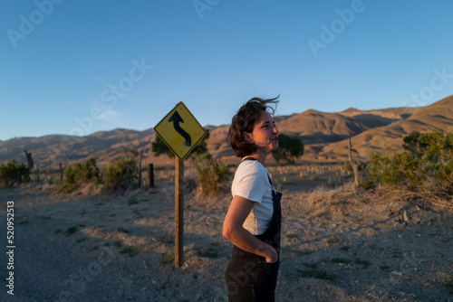 Young woman gazes into distance in desert