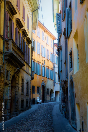 Fototapeta Naklejka Na Ścianę i Meble -  Evening Shot of a Narrow Street in the Old City of Bergamo, Italy