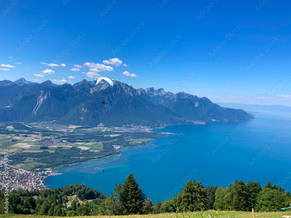 Montreux, Switzerland: 01-08-2022: Panorama of the Switzerland Alpine mountains. Ridges, peaks and lake are visible in the background. Beautiful view in the French Canton.