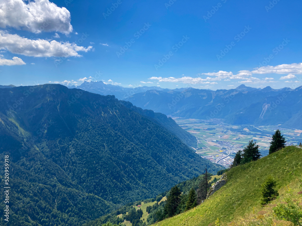 Montreux, Switzerland: 01-08-2022: Panorama of the Switzerland Alpine mountains. Ridges, peaks and lake are visible in the background. Beautiful view in the French Canton.