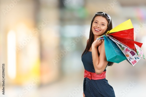 Portrait excited beautiful woman hold shopping bags, love shopping