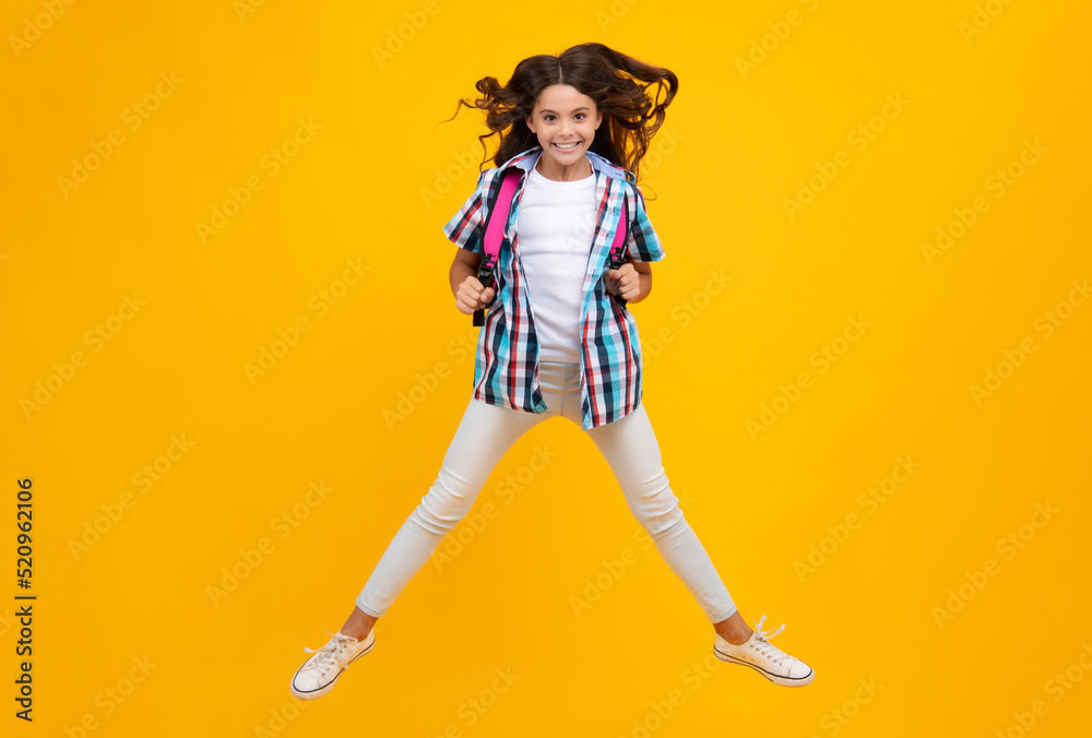 Amazed teen girl. Schoolgirl with backpack. Teenager student, isolated background. Learning and knowledge. Go study. Children education concept. Back to school. Run and jump.
