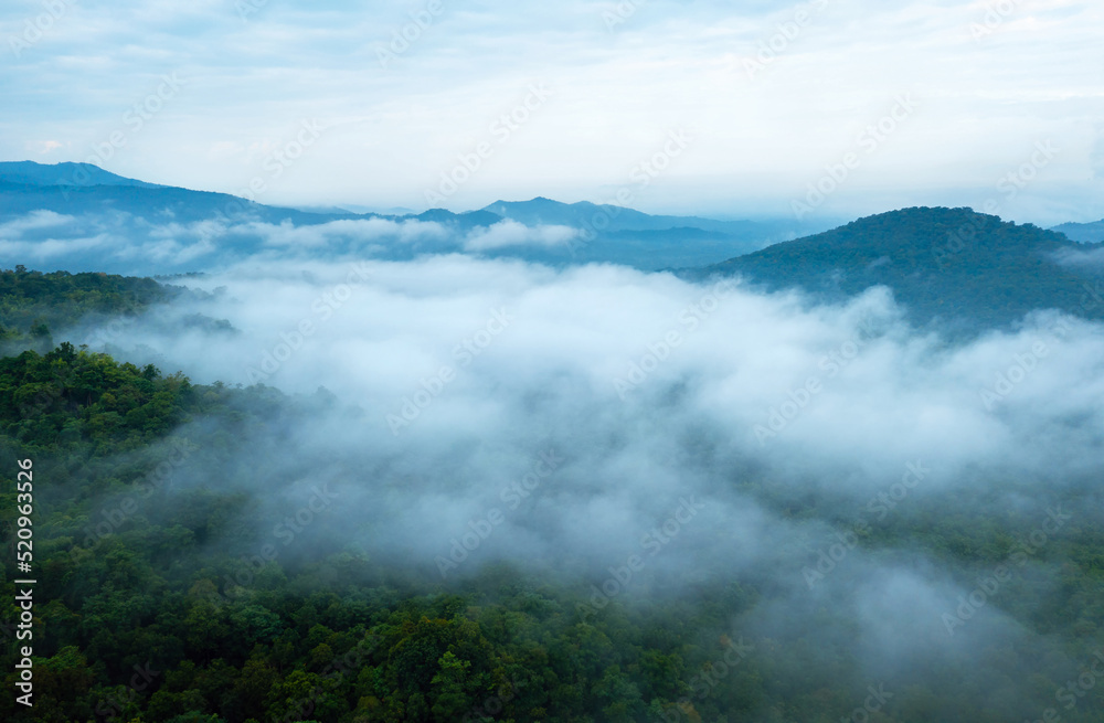 Aerial view Beautiful  of morning scenery Golden light sunrise And the mist flows on high mountains forest. Pang Puai, Mae Moh, Lampang, Thailand.	