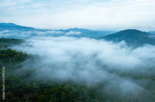 Fototapeta Naklejka Na Ścianę i Meble -  Aerial view Beautiful  of morning scenery Golden light sunrise And the mist flows on high mountains forest. Pang Puai, Mae Moh, Lampang, Thailand.	