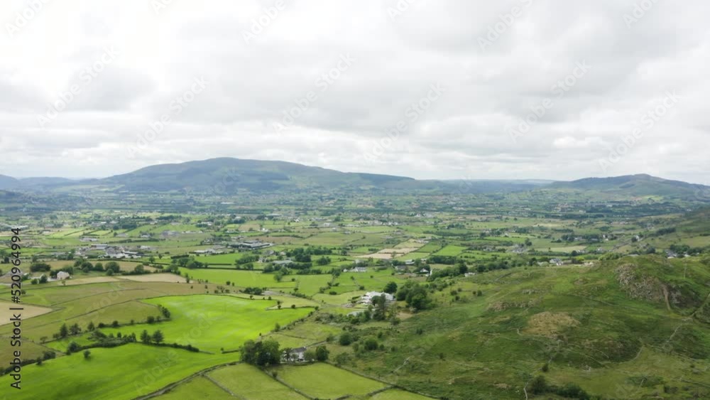Aerial Flight Over flagstaff viewpoint area, countryside, Newry, Northern Ireland during the summer on a sunny day. Hiking and Tourism concept Aerial Flight Over flagstaff viewpoint area, countryside, Newry, Northern Ireland during the summer on a sunny day. Hiking and Tourism concept