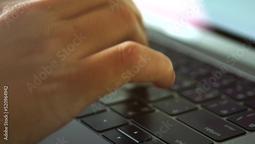 person typing on a laptop