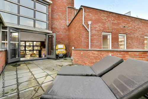 stylish solarium terrace of a house with hammocks photo