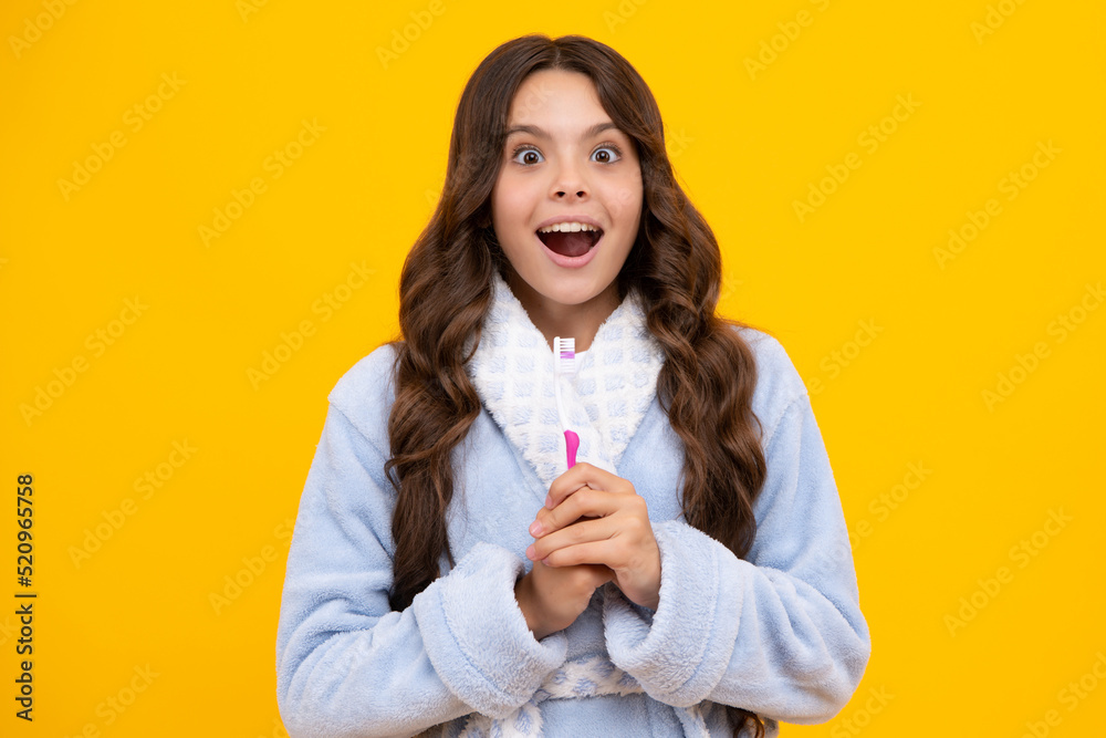 Night brushing teeth. Girl cleaning teeth. Kid brushing teeth with brush. Dental hygiene, tooth care. Girl cares about health of his teeth. Excited expression, cheerful and glad. Night brushing teeth. Girl cleaning teeth. Kid brushing teeth with brush. Dental hygiene, tooth care. Girl cares about health of his teeth. Excited expression, cheerful and glad.