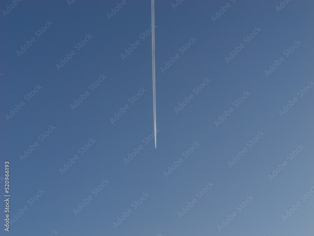 Sky before sunset, lonely airliners and airplane clouds