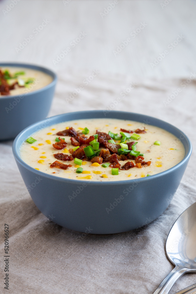 Homemade Corn Chowder with Bacon in Bowls, side view. Homemade Corn Chowder with Bacon in Bowls, side view.