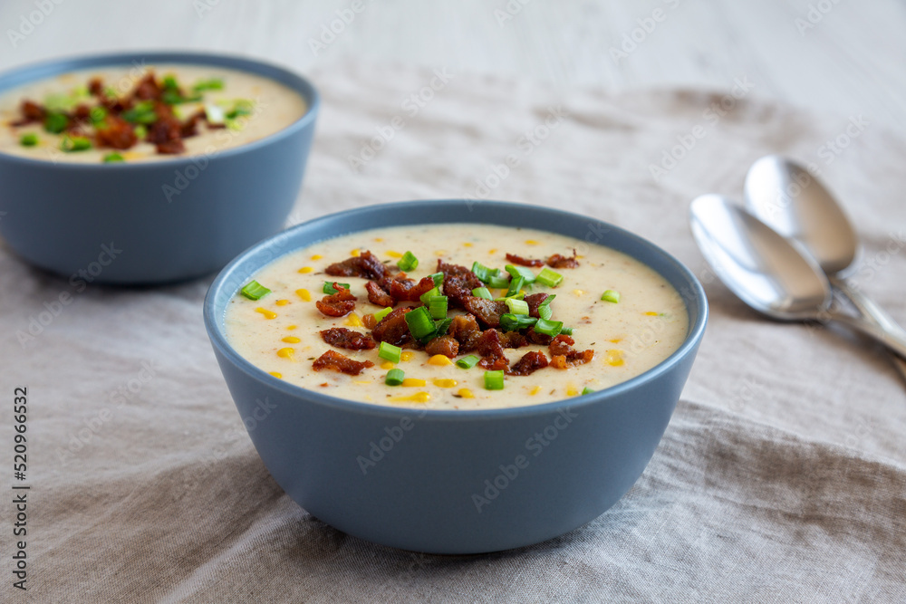 Homemade Corn Chowder with Bacon in Bowls, side view. Homemade Corn Chowder with Bacon in Bowls, side view.