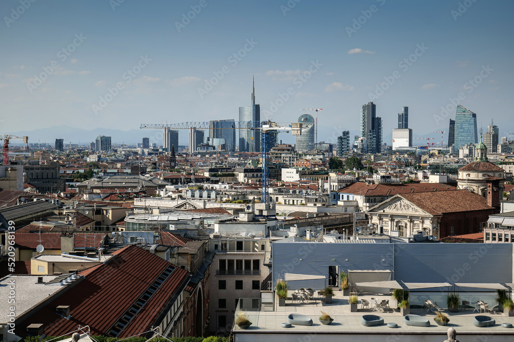 Milan from above. Aerial view over this beautiful city from Italy. View from Milan Cathedral to new modern office city district. Milan from above. Aerial view over this beautiful city from Italy. View from Milan Cathedral to new modern office city district.