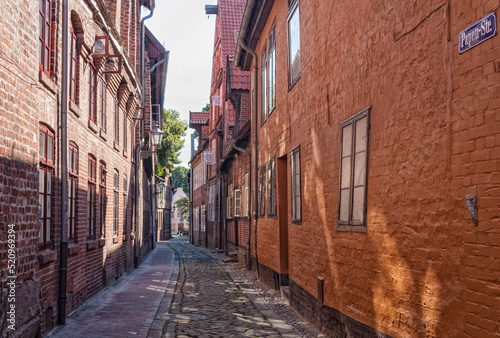 A typical alley with slanting houses at the old town of L  neburg  the Papenstrasse