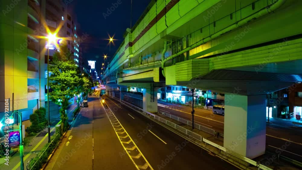 A night timelapse of the traffic jam under the highway in Tokyo wide shot zoom