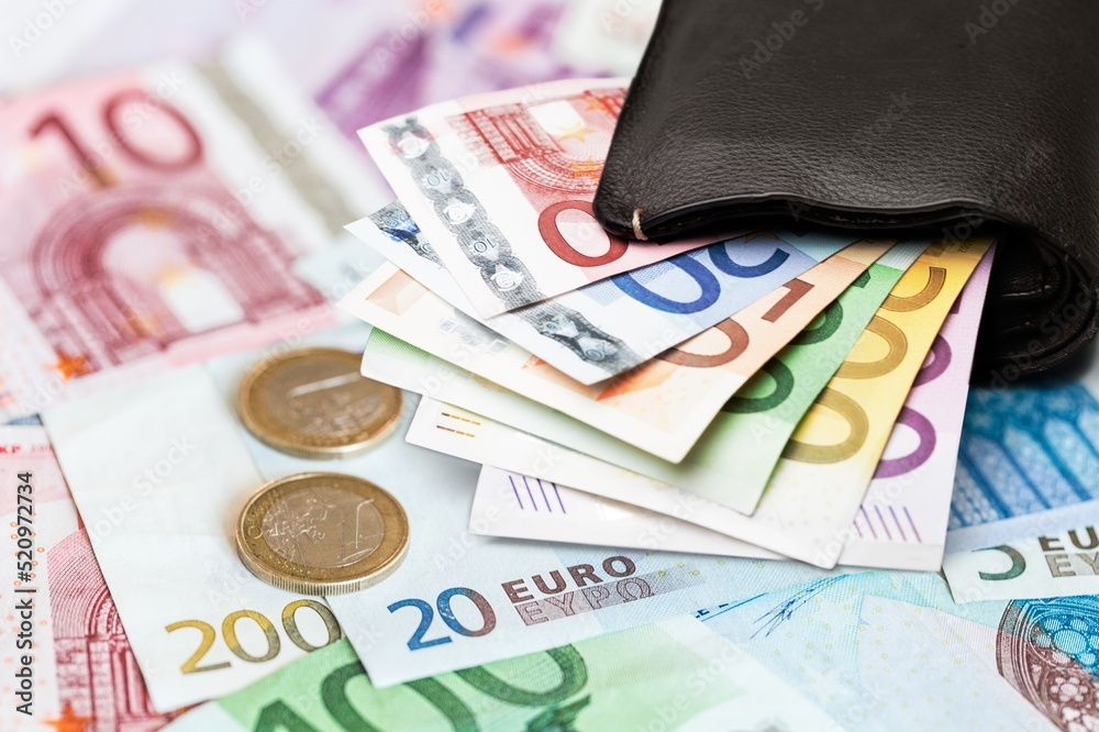Euro in stationery band on pile of paper banknotes. Heap of money Euro in stationery band on pile of paper banknotes. Heap of money
