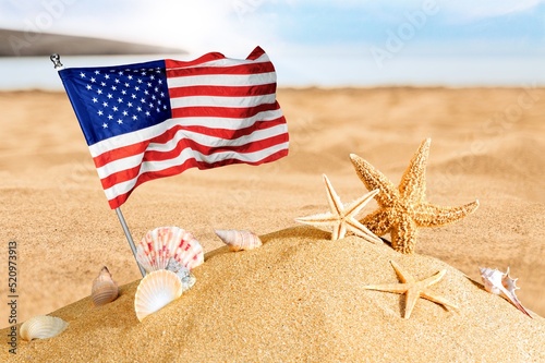Fototapeta Naklejka Na Ścianę i Meble -  Beach, Ocean, Starfish, American flag. Summer vacations. Sunny day. Tropical nature. Seascape concept for travel agency