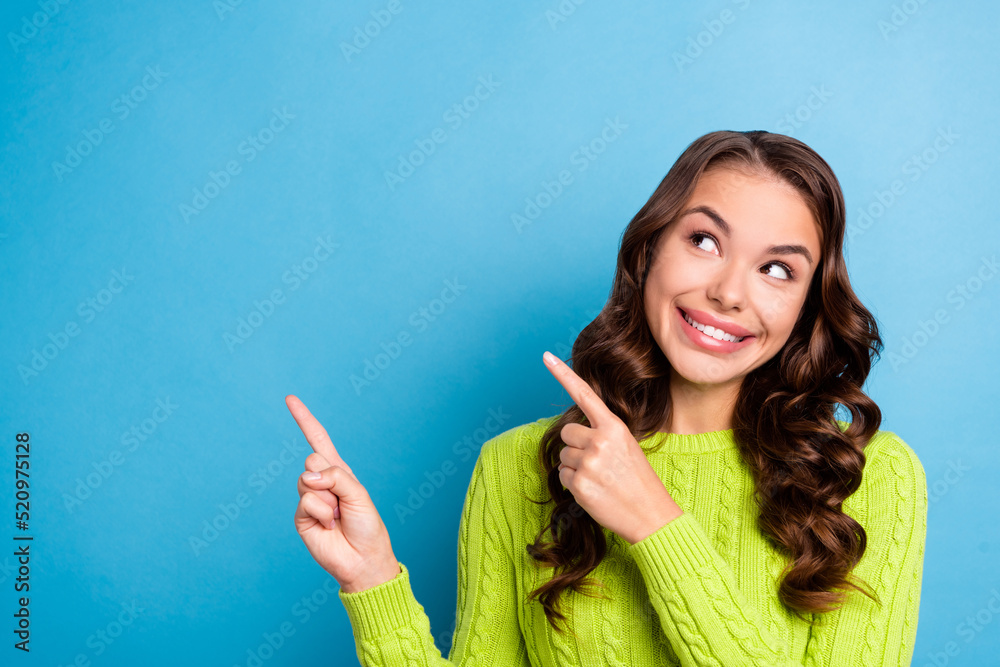 Photo of pretty woman wavy hairstyle fingers point useful tips wear stylish autumn green knitwear jumper isolated on blue color background Photo of pretty woman wavy hairstyle fingers point useful tips wear stylish autumn green knitwear jumper isolated on blue color background